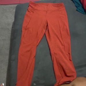Lululemon fast and free 25in, size 8, orange color with white little line